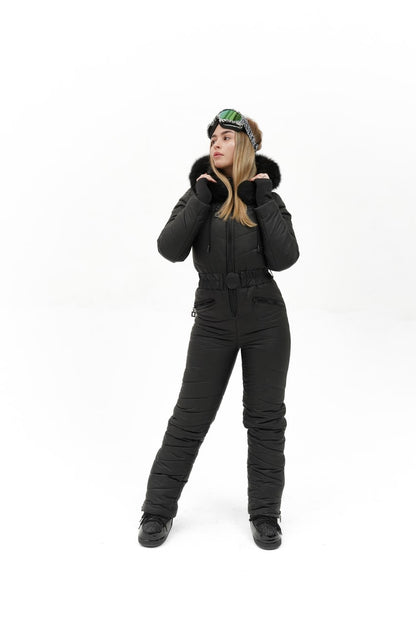 Person wearing a black snowsuit on a white background