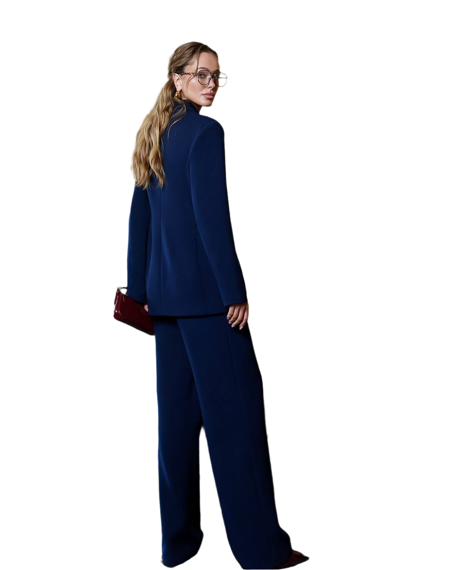 Woman wearing a navy blue suit with a white background