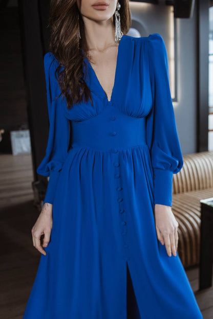 Woman wearing a blue dress with a blurred background
