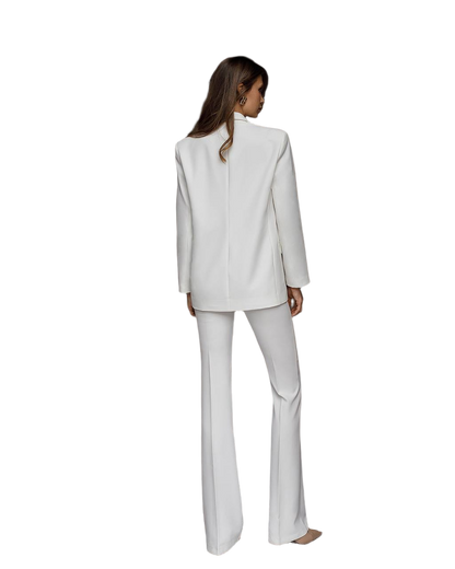 Woman wearing a white suit on a white background