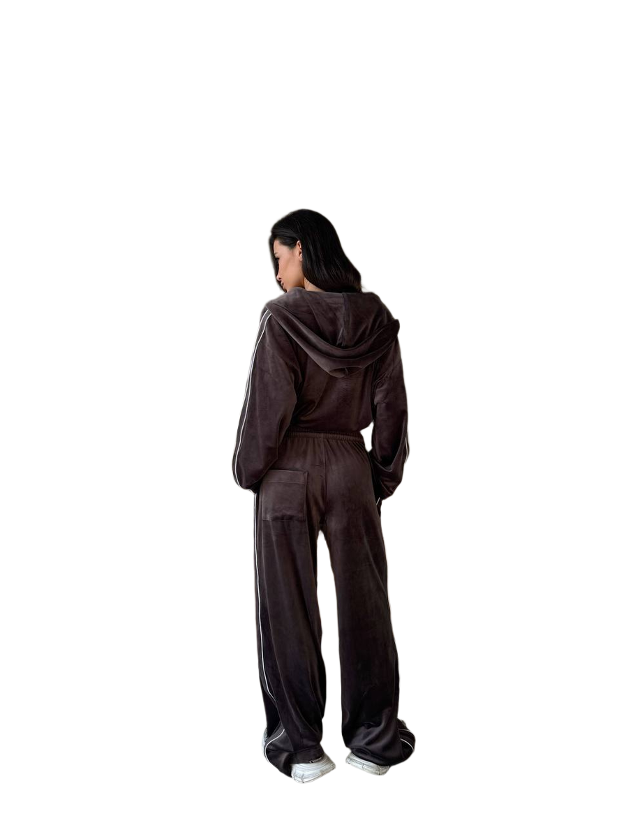 Person wearing a brown tracksuit from behind on a white background