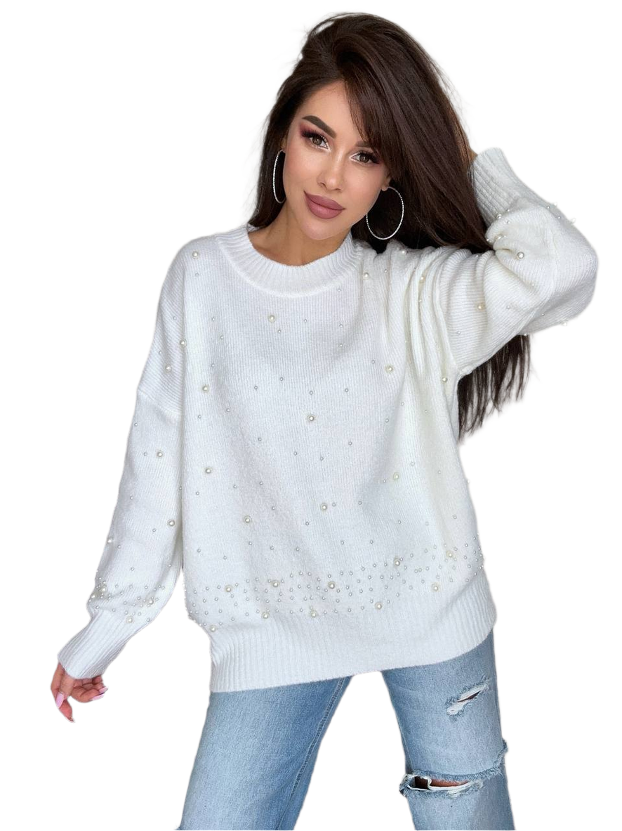 Woman wearing a white sweater with decorative elements on a white background