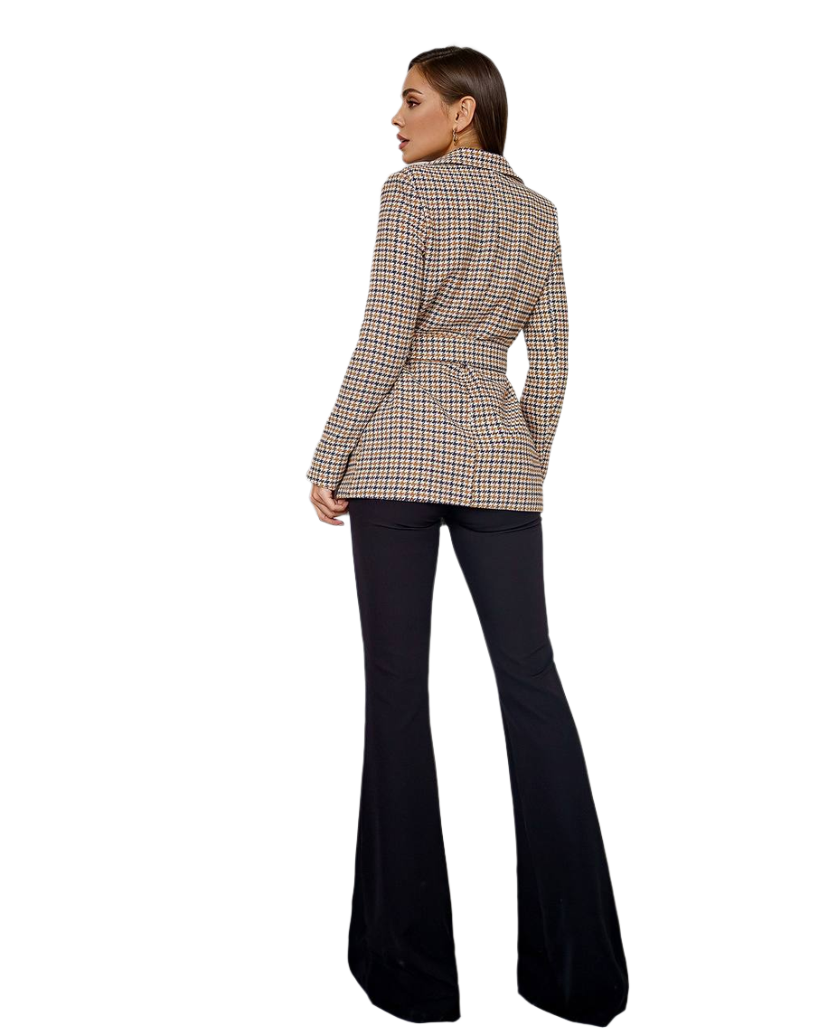 Person wearing a plaid blazer and black flared pants on a white background