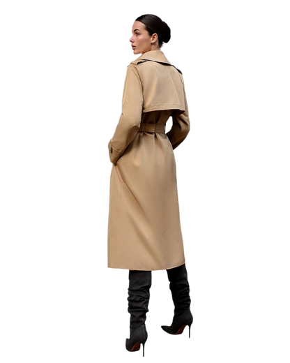 Woman wearing a beige trench coat on a white background