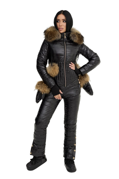 Person wearing a black snowsuit with fur trim on a white background