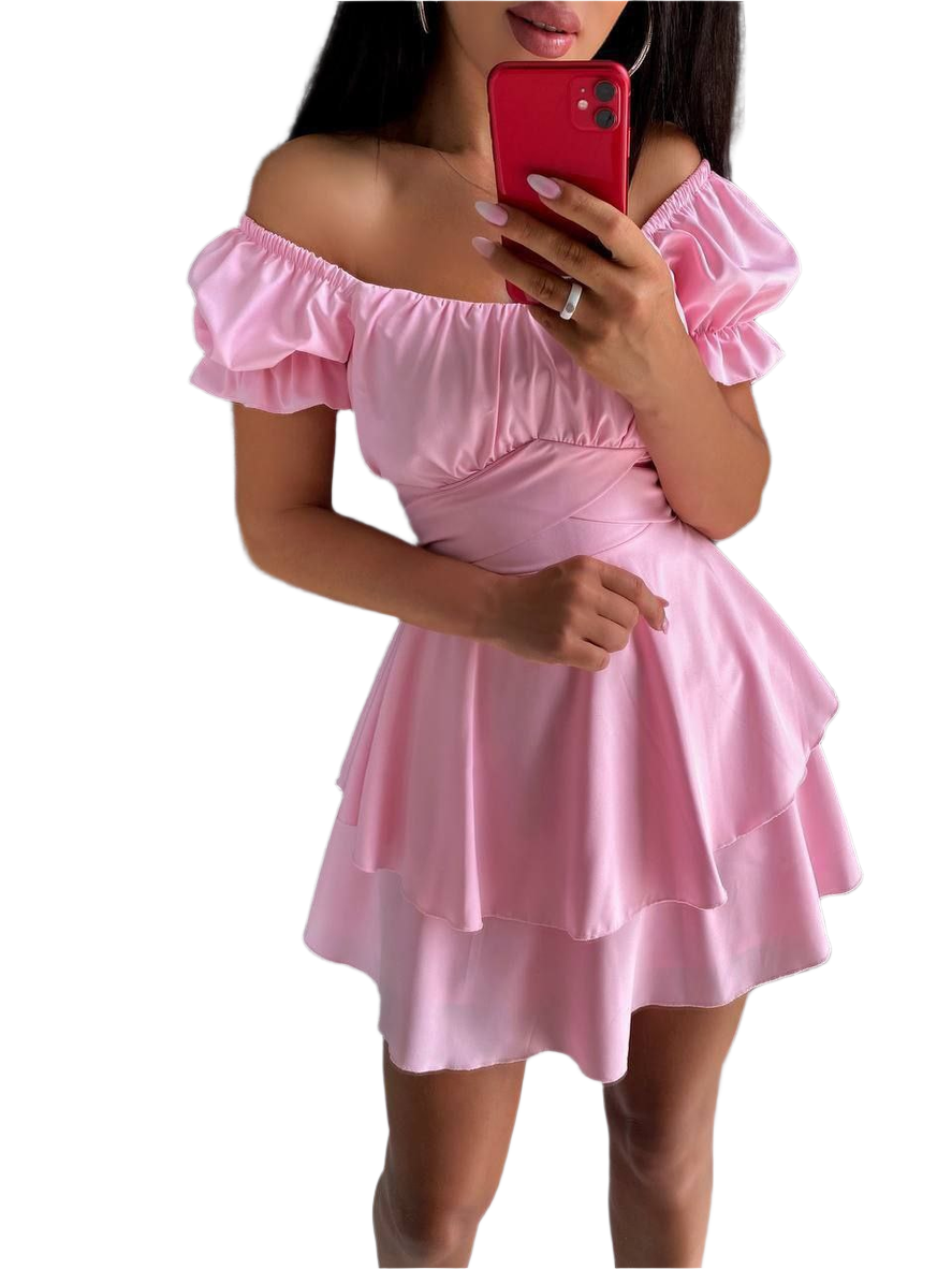 Pink off-shoulder dress worn by a person on a white background