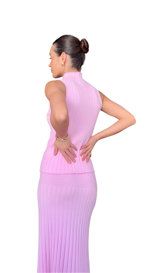 Woman wearing a pink dress on a white background