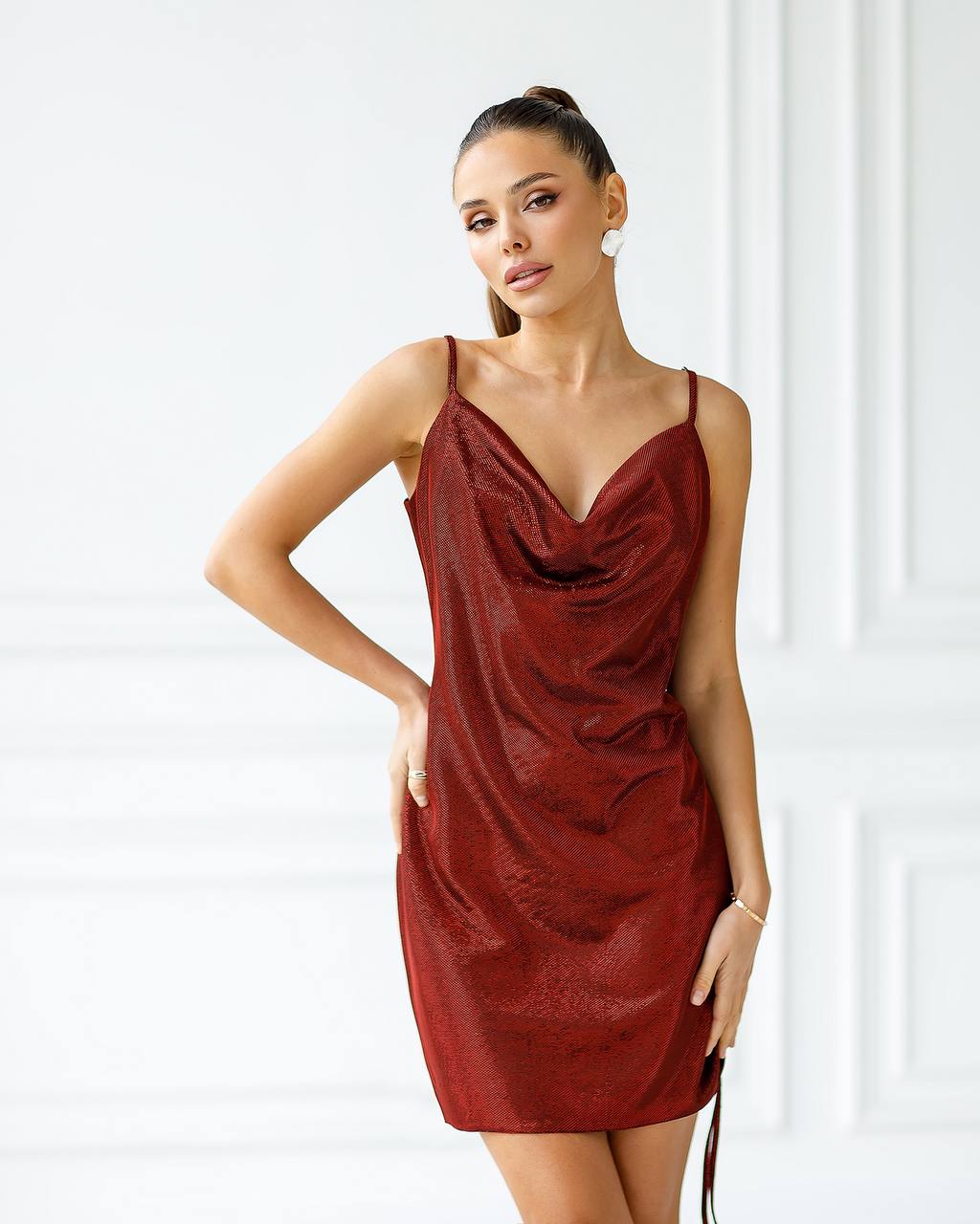 Woman wearing a red dress against a white background