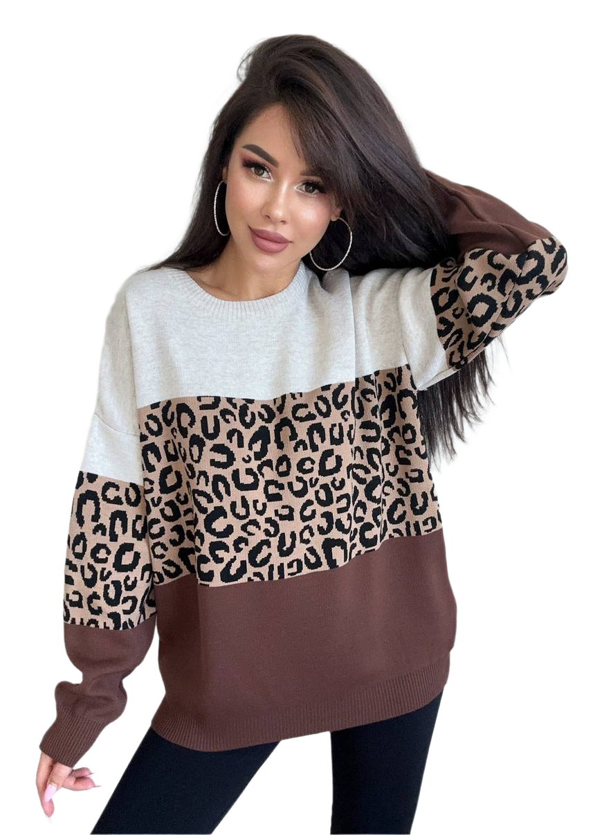 Woman wearing a sweater with leopard print sleeves on a white background