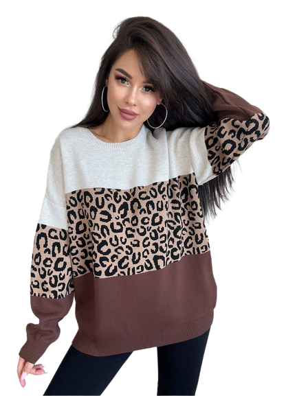 Woman wearing a sweater with leopard print sleeves on a white background