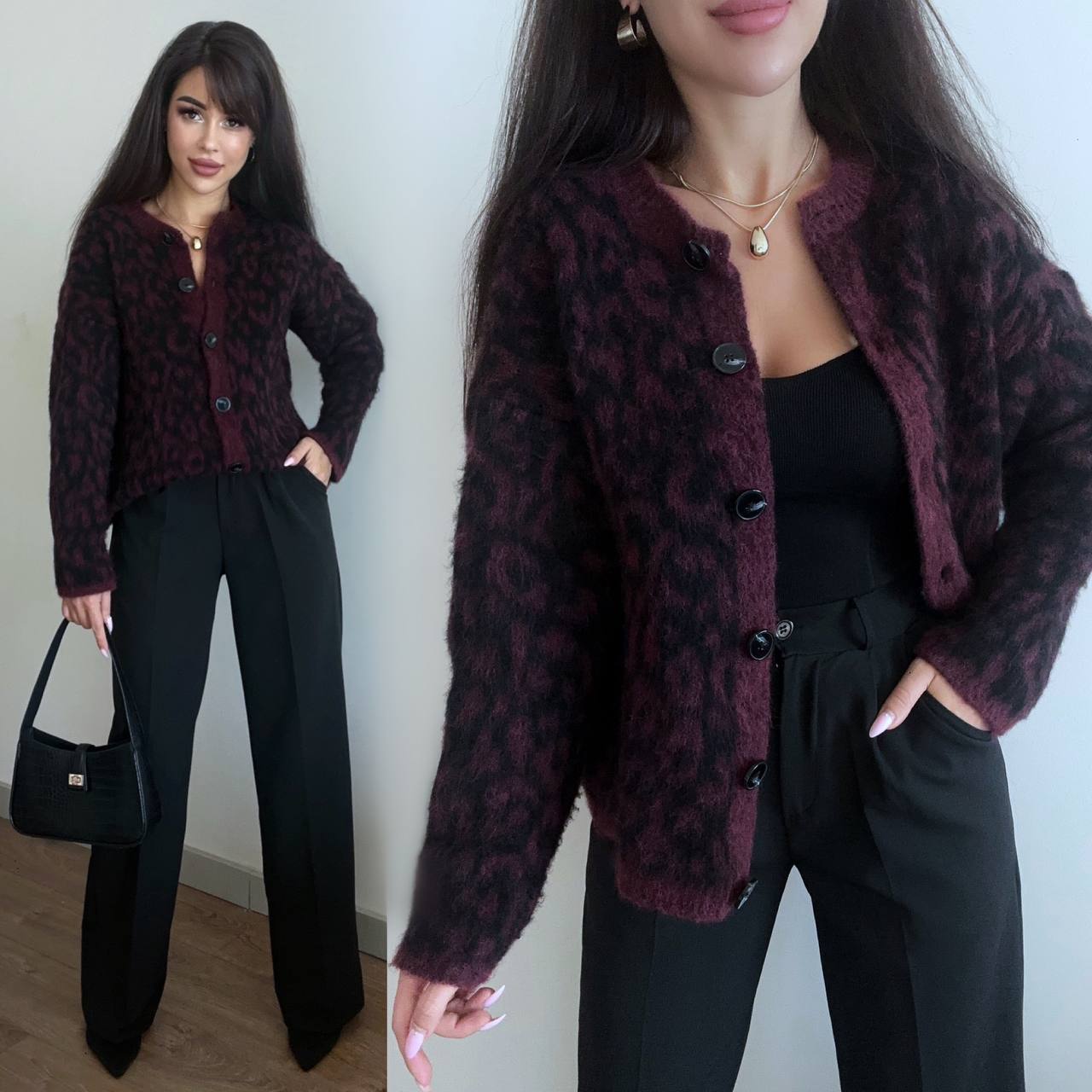 Woman wearing a patterned jacket and black pants, holding a black handbag.