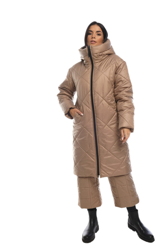 Woman wearing a beige quilted coat on a white background