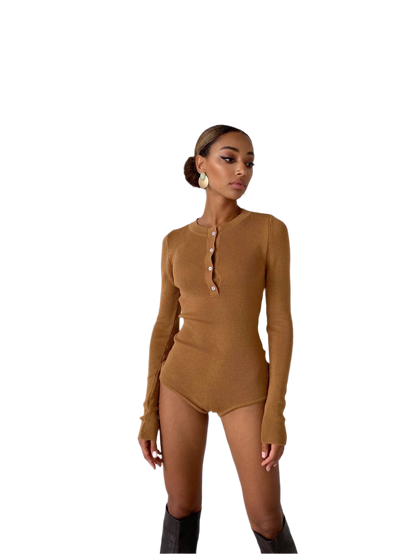 Woman wearing a brown long-sleeve bodysuit on a white background