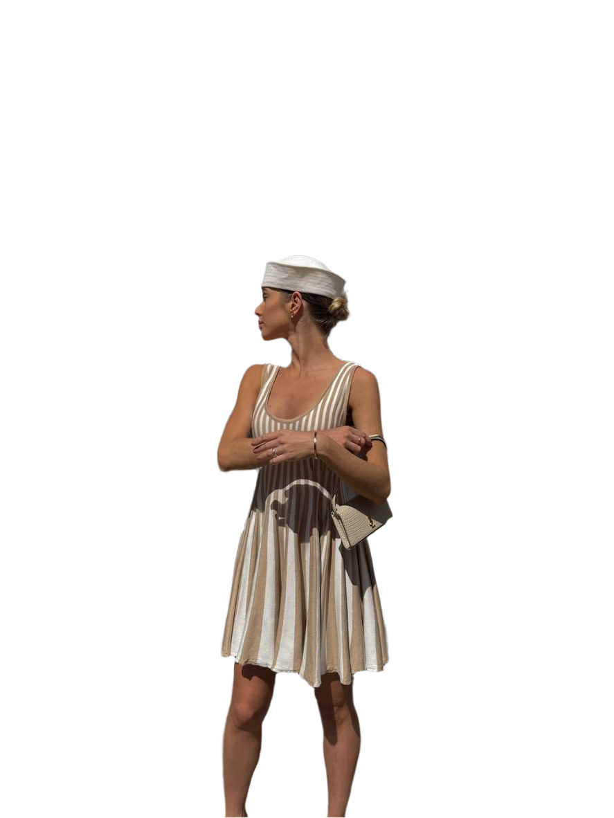 Woman wearing a vintage-style dress with a white background