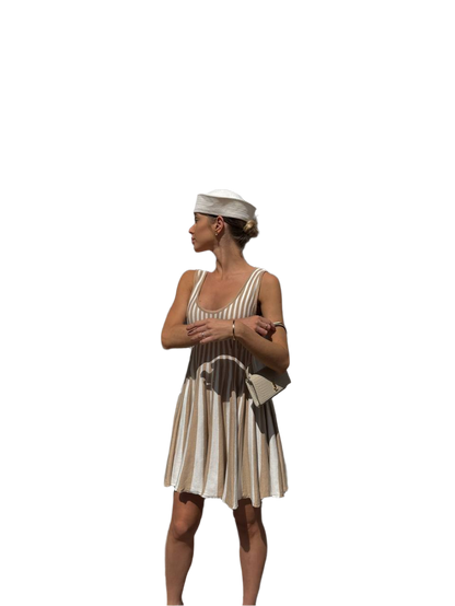 Woman wearing a vintage-style dress with a white background