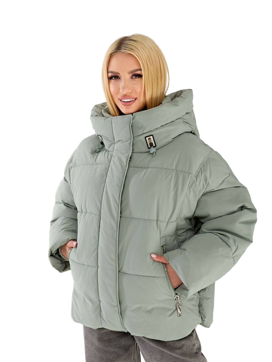 Woman wearing a light gray winter jacket on a white background