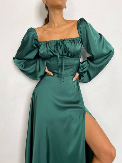 Green dress with puffed sleeves on a white background