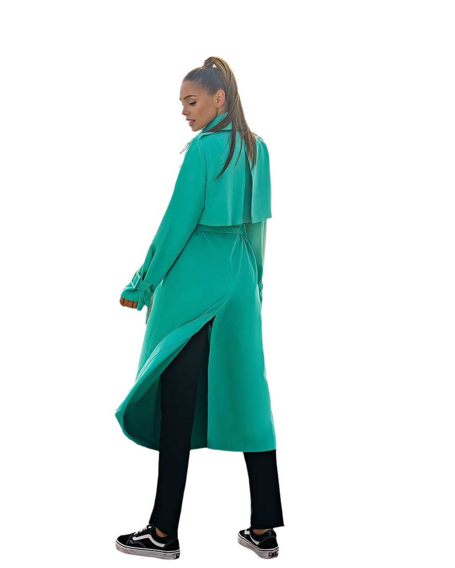 Person wearing a teal coat on a white background