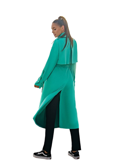 Person wearing a teal coat on a white background