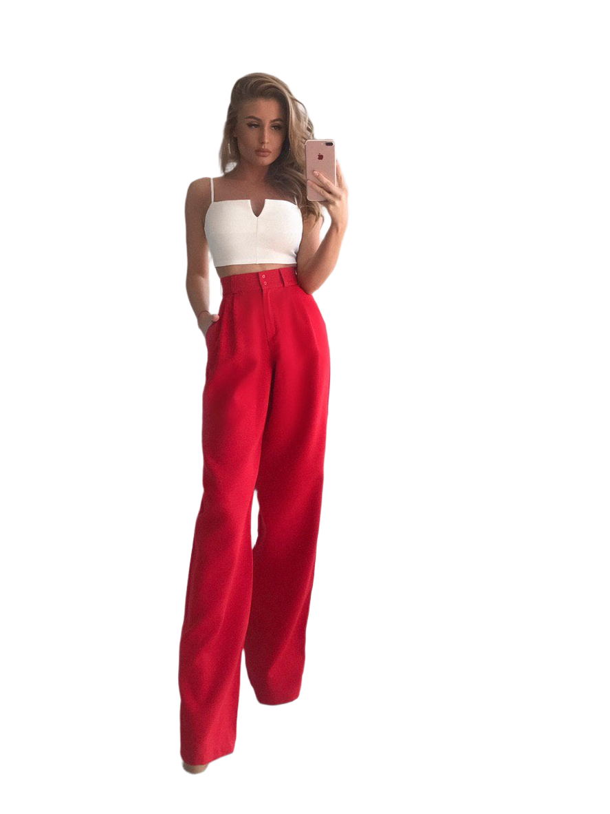 Woman wearing a white top and red pants on a white background