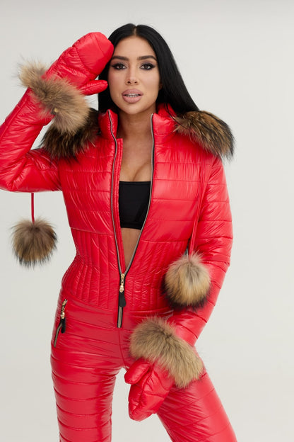 Person wearing a red puffer suit with fur trim on a white background