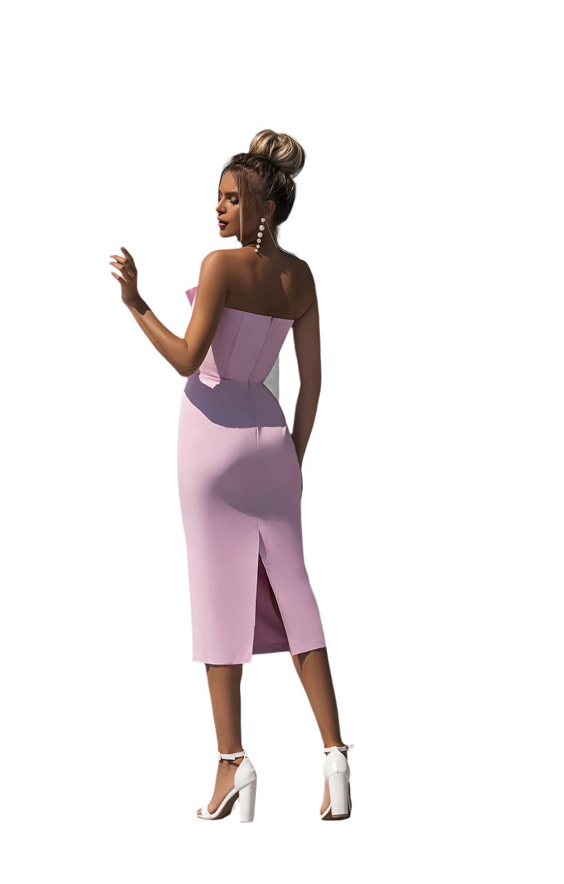 Woman wearing a strapless pink dress with a white background