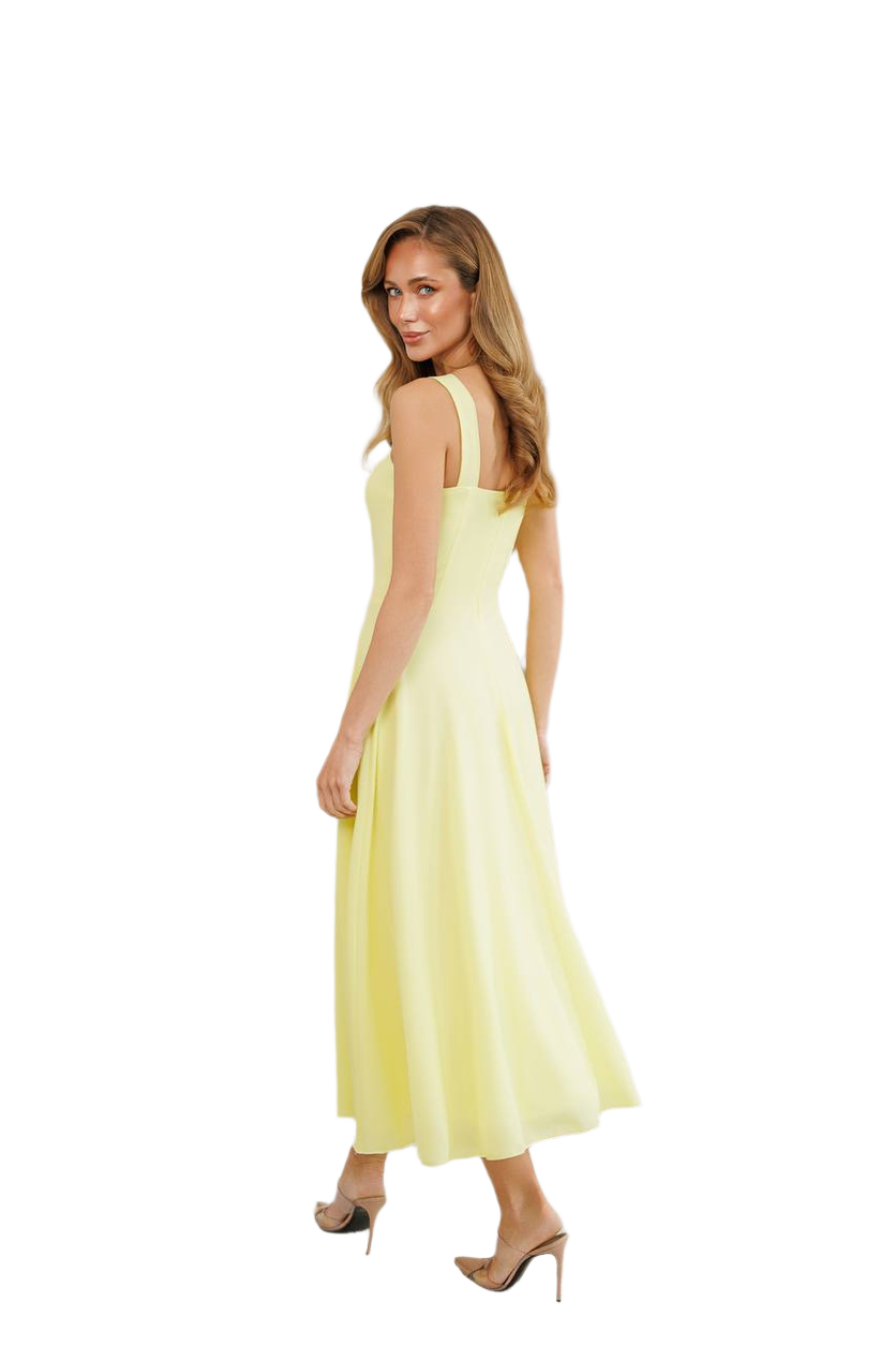 Woman wearing a light yellow dress on a white background