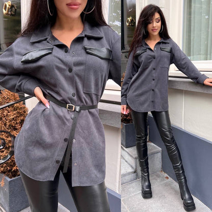 Woman wearing a gray shirt and black leather pants with knee-high boots, standing outdoors.