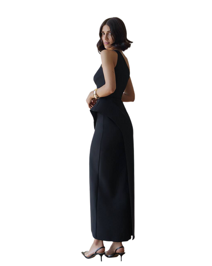 Woman wearing a black sleeveless dress on a white background