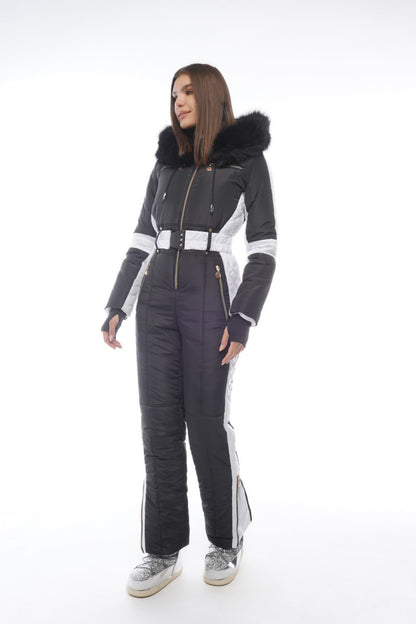 Person wearing a gray and black ski suit with white accents on a white background