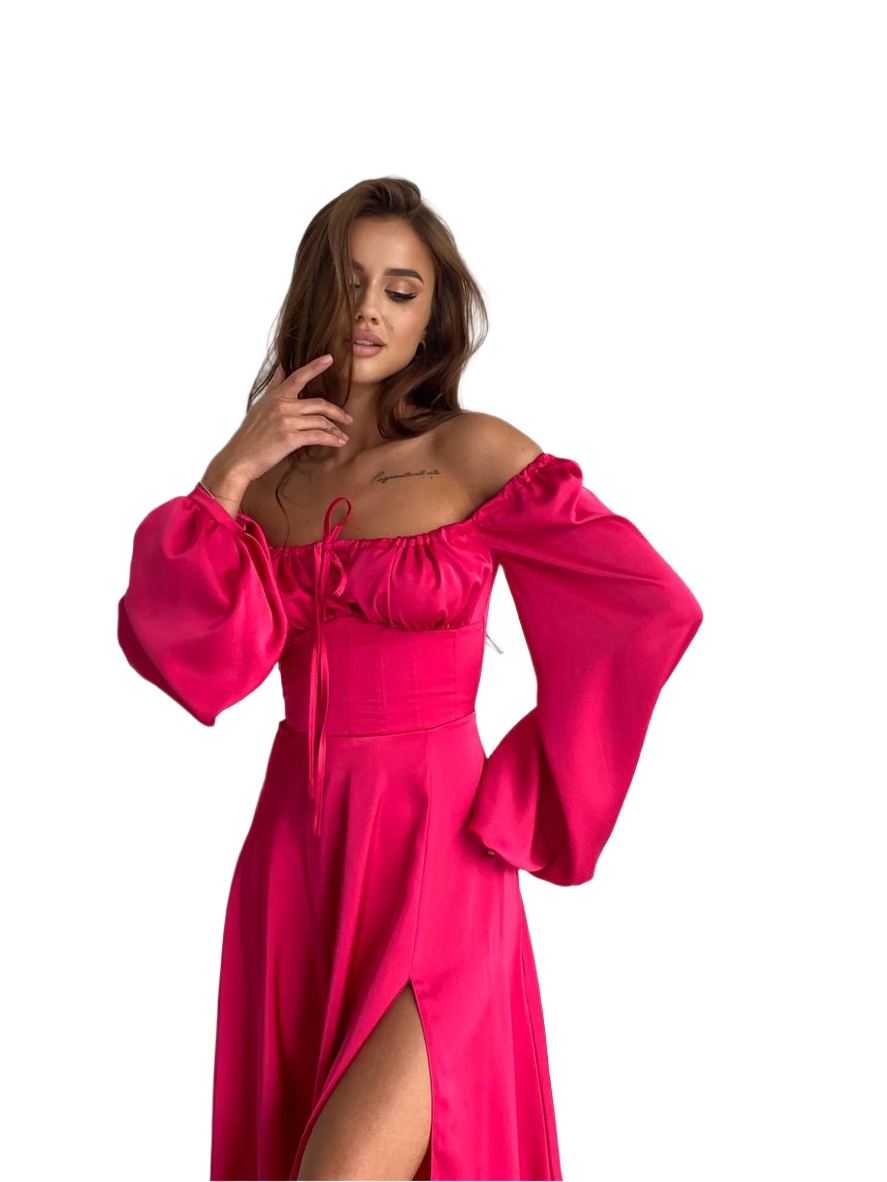 Woman wearing a bright pink off-shoulder dress with long sleeves on a white background
