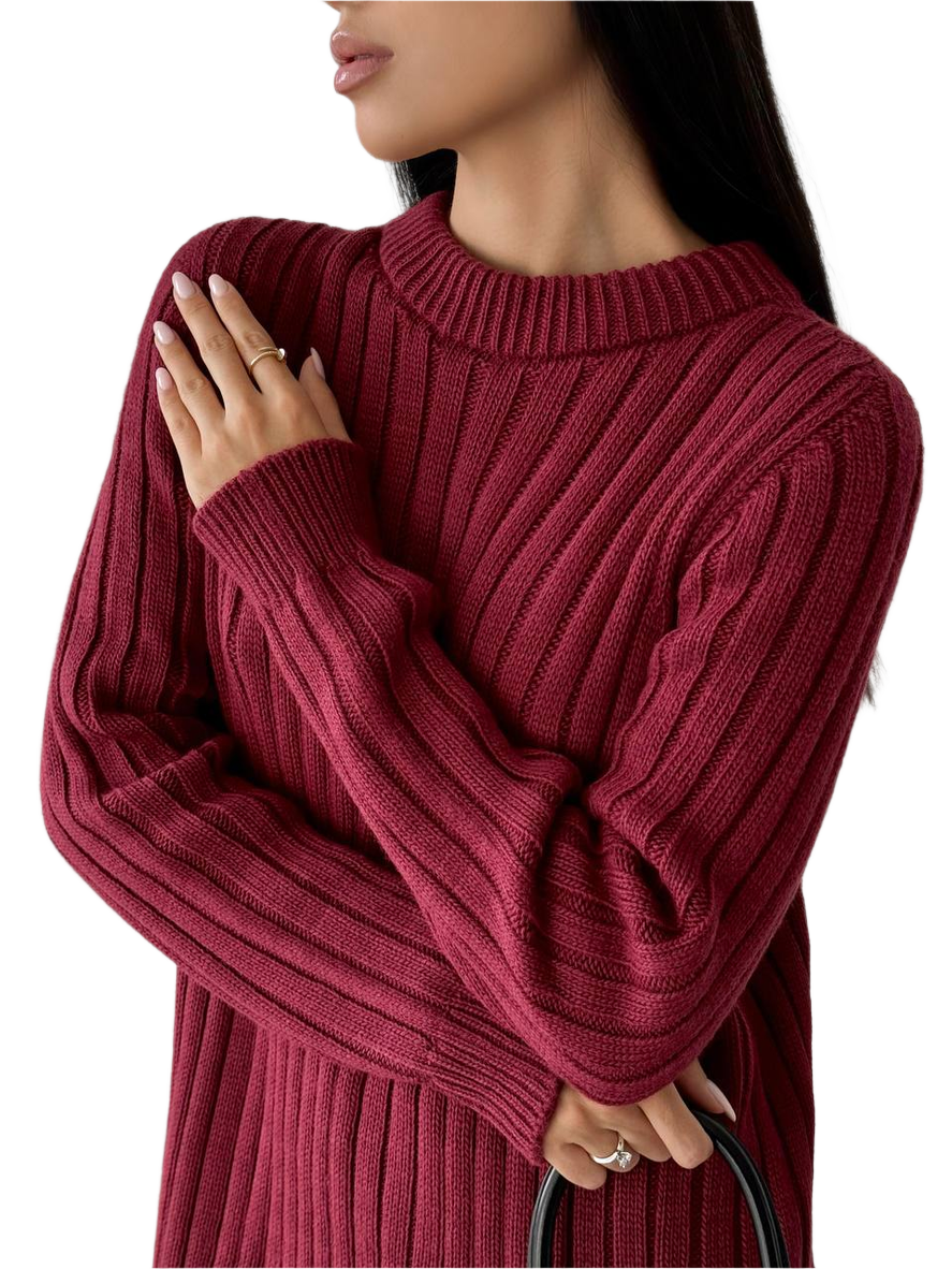 Red ribbed sweater worn by a person on a white background