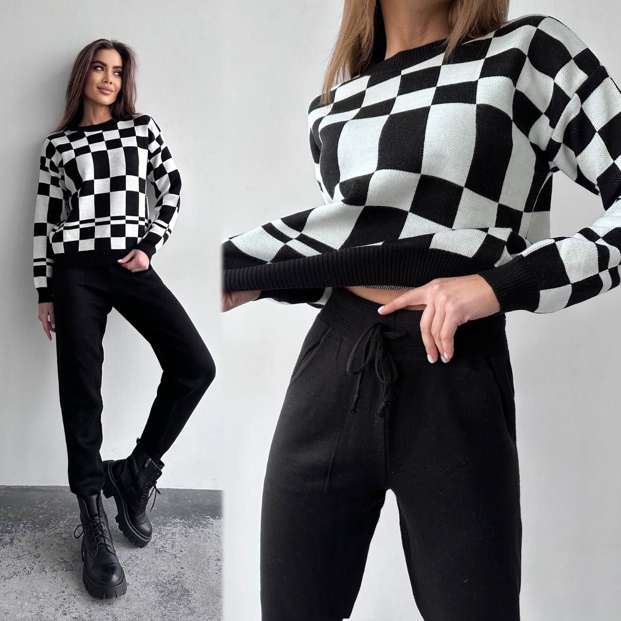 Woman wearing a black and white checkered sweater with a plain background