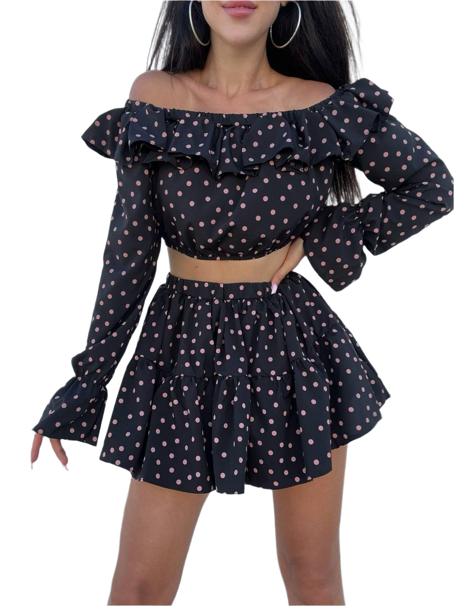 Black polka dot off-shoulder top and skirt set on a white background