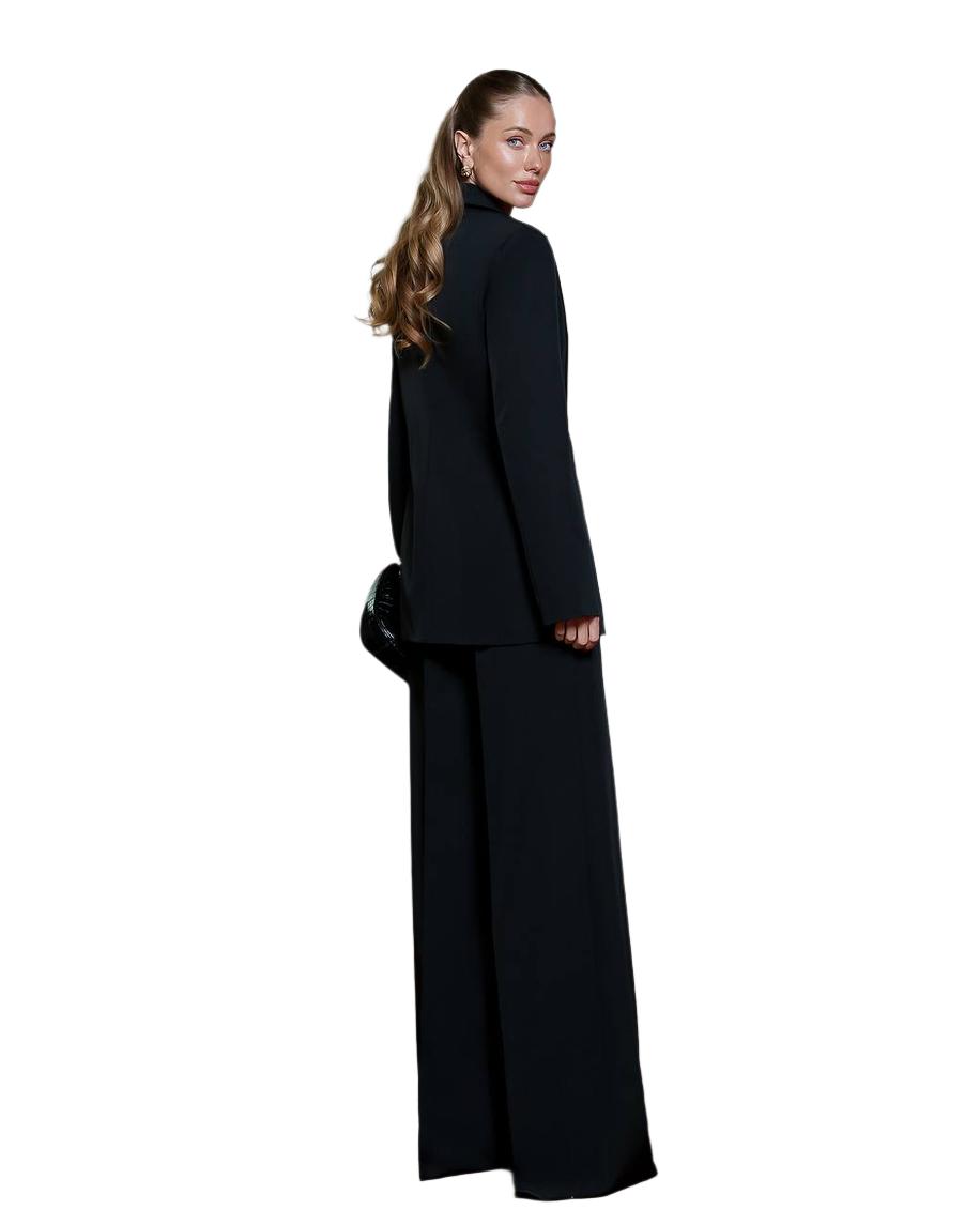 Woman wearing a black suit on a white background