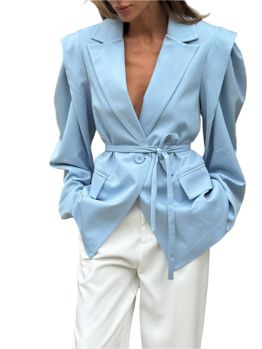 Light blue blazer worn by a person on a white background