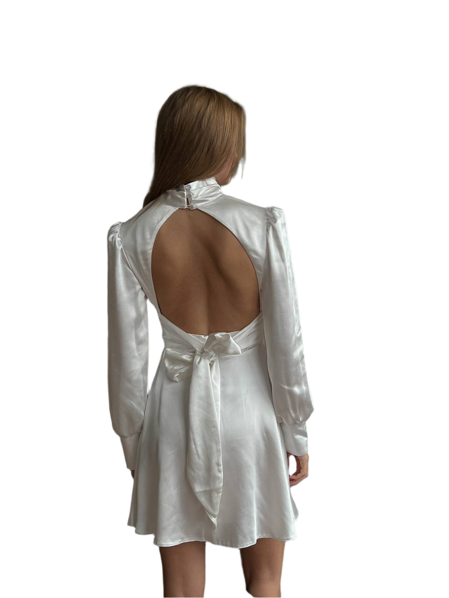 White open-back dress worn by a model on a white background