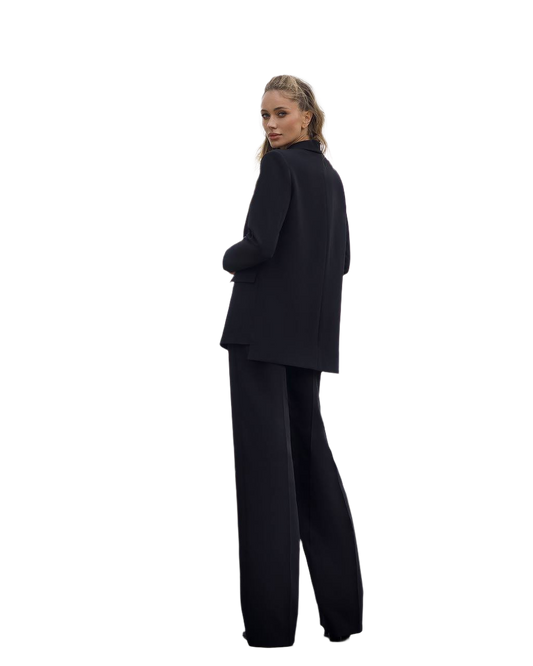 Person wearing a black suit on a white background