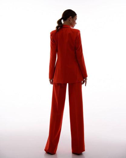 Person wearing a red suit on a white background