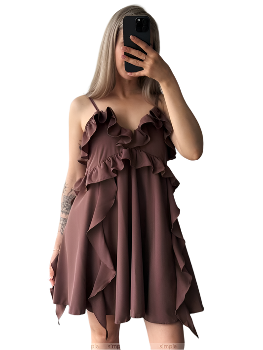 Woman wearing a brown ruffled dress on a white background