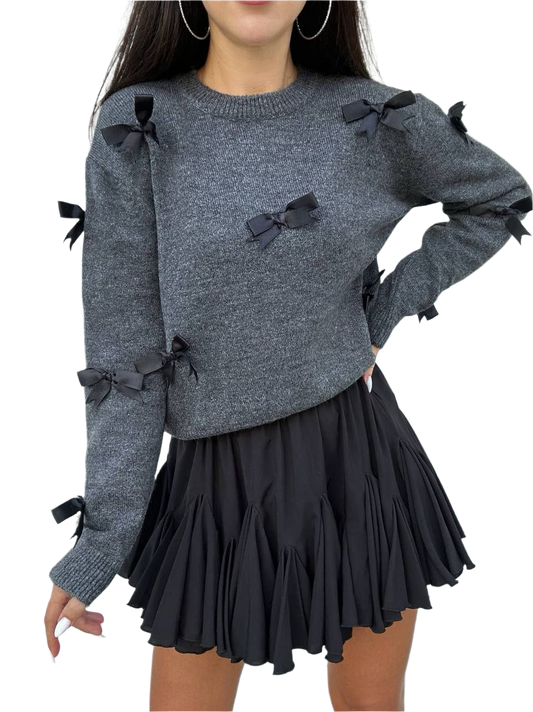 Gray sweater with black bows and a black skirt on a white background