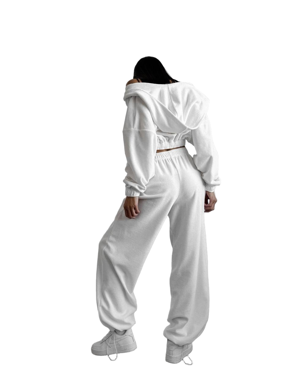 Person wearing a white tracksuit on a white background