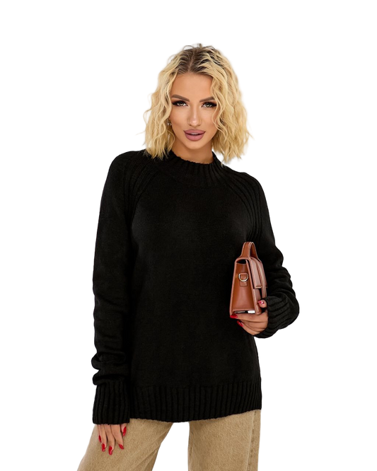 Woman wearing a black sweater holding a brown handbag on a white background