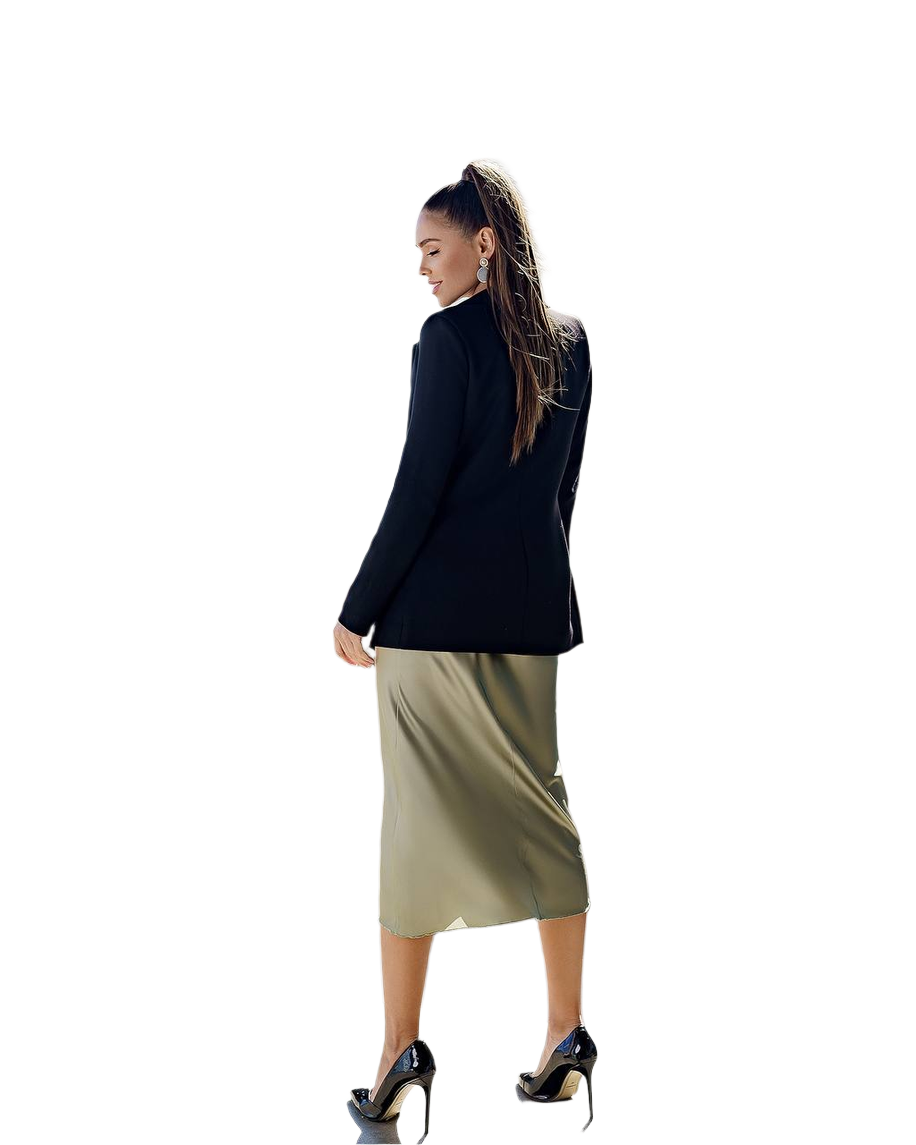 Woman wearing a black blazer and beige skirt on a white background