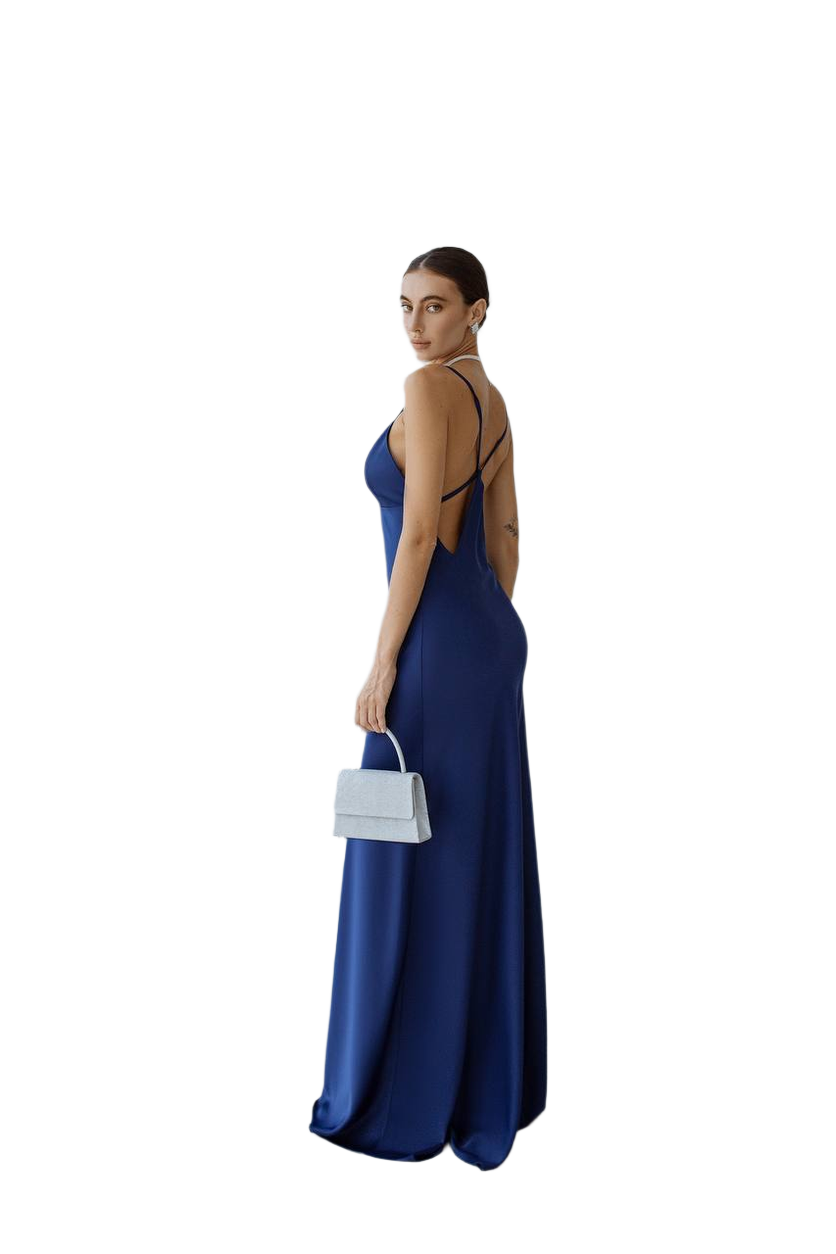 Woman wearing a blue evening gown with cut-out design on a white background