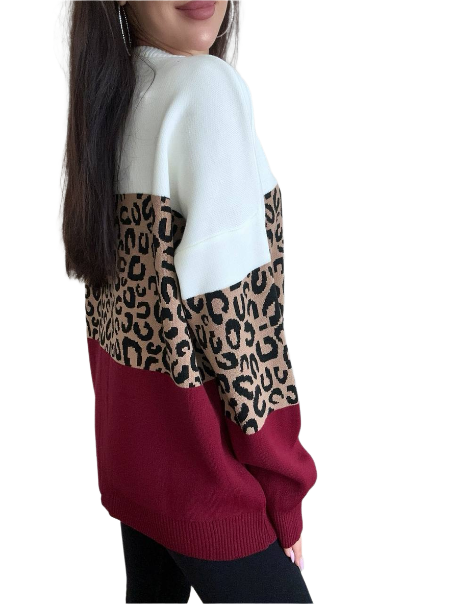 Sweater with leopard print and maroon color block on a white background
