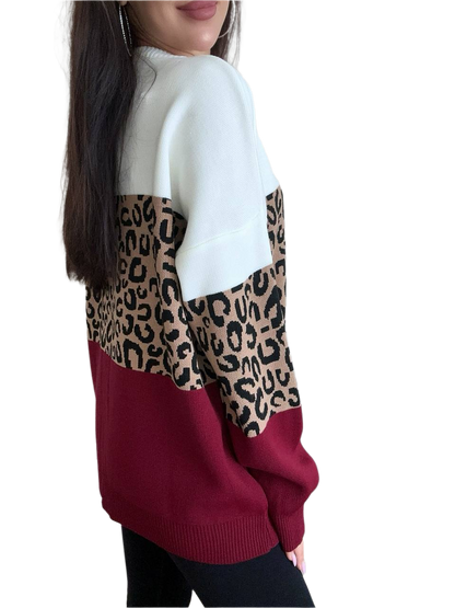 Sweater with leopard print and maroon color block on a white background