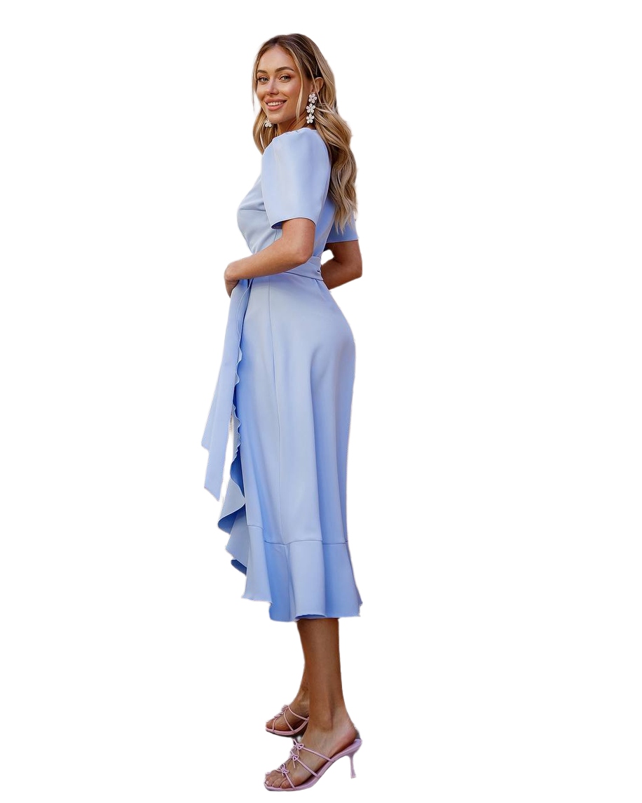 Woman wearing a light blue dress with a white background