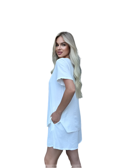 Woman wearing a light blue dress on a white background