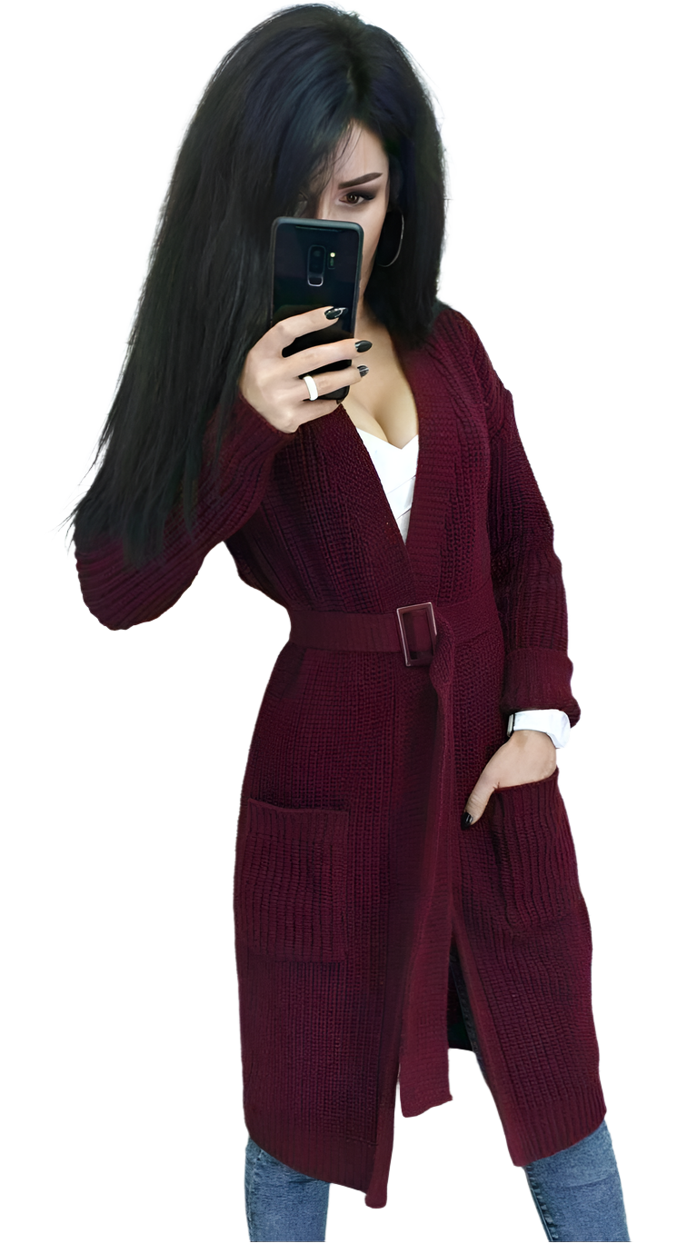 Person wearing a burgundy cardigan on a white background